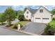 Charming white brick home with two-car garage and mature landscaping at 600 Driftwood Dr, Gibsonville, NC 27249