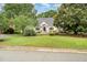 Charming one story brick home with a landscaped yard and front lawn at 600 Driftwood Dr, Gibsonville, NC 27249