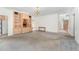 Spacious living room with carpeted floors, built-in shelving, and arched doorway at 600 Driftwood Dr, Gibsonville, NC 27249