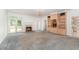 Elegant living room with fireplace, built-in bookshelves, and natural light, perfect for comfortable living at 600 Driftwood Dr, Gibsonville, NC 27249