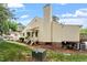 Exterior view of the home with a backyard, patio steps, chimney and some wooded area at 6540 English Oaks Dr, Raleigh, NC 27615