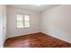 Bright, naturally lit bedroom with wood floors, window and closet at 6540 English Oaks Dr, Raleigh, NC 27615