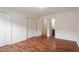 Comfortable bedroom showcasing wood floors, closet space, and connecting door to the home's bathroom at 6540 English Oaks Dr, Raleigh, NC 27615