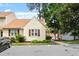 View of a light-yellow townhome with a brown roof and dedicated parking at 6540 English Oaks Dr, Raleigh, NC 27615