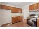 Kitchen with stainless steel appliances, ample counter space, and wood cabinets at 6540 English Oaks Dr, Raleigh, NC 27615