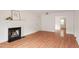 Spacious living room with a cozy fireplace and wood floors at 6540 English Oaks Dr, Raleigh, NC 27615
