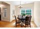 Bright eat-in dining area with hardwood floors, pendant lighting and large windows at 68 Tanners Way, Clayton, NC 27527