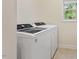 Laundry room featuring modern washer and dryer units, offering convenience for chores at 68 Tanners Way, Clayton, NC 27527