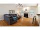 Comfortable living room with hardwood floors, a fireplace, and neutral tones offering a cozy atmosphere at 68 Tanners Way, Clayton, NC 27527