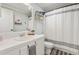 Bathroom featuring a vanity and shower with modern decor, with a gray towel and mirror at 724 Harolds Northfield Dr, Cedar Grove, NC 27231