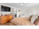 Bedroom showcasing a TV, wooden dresser, and a cozy chair in the corner with natural light at 724 Harolds Northfield Dr, Cedar Grove, NC 27231