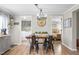 A dining room with a table set for four, view to a laundry room and a bedroom at 724 Harolds Northfield Dr, Cedar Grove, NC 27231