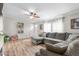 Inviting living room features a large sectional sofa with bright windows and neutral decor at 724 Harolds Northfield Dr, Cedar Grove, NC 27231