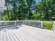 Spacious back deck for outdoor entertaining offers peaceful views of the surrounding yard and mature trees at 7605 Copper Mine Ln, Raleigh, NC 27615