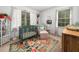Bright and airy Bedroom with a floral rug, crib, and charming decor at 7605 Copper Mine Ln, Raleigh, NC 27615