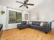 Cozy living room with a comfortable sectional sofa, natural light, and modern decor at 7605 Copper Mine Ln, Raleigh, NC 27615