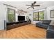 Bright living room with hardwood floors, a ceiling fan, and plenty of space for entertaining guests at 7605 Copper Mine Ln, Raleigh, NC 27615