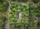Aerial view of property lines surrounded by lush greenery, showcasing its private setting and neighborhood at 7801 Wood Way Ct, Raleigh, NC 27606
