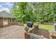 Charming brick patio with space for outdoor seating and a grill at 7801 Wood Way Ct, Raleigh, NC 27606