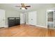 Bedroom with hardwood floors, two closets, and bathroom access at 7801 Wood Way Ct, Raleigh, NC 27606