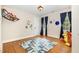 Cozy bedroom with hardwood floors and colorful accents at 7801 Wood Way Ct, Raleigh, NC 27606