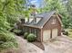 Traditional brick home with a two-car garage and well-maintained landscaping, offering timeless appeal and curb appeal at 7801 Wood Way Ct, Raleigh, NC 27606
