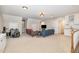 Spacious living room with carpet flooring, ample seating, a wet bar, and a drum set at 7801 Wood Way Ct, Raleigh, NC 27606