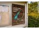 Community trails map on a wooden sign with trail markers and local information at 9 Lake Village Dr, Durham, NC 27713