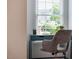 Comfortable home office with a gray desk and chair near a window, offering natural light at 9 Lake Village Dr, Durham, NC 27713