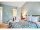 Comfortable main bedroom with natural light and access to the ensuite bathroom at 9 Lake Village Dr, Durham, NC 27713