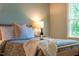 Comfortable main bedroom with natural light and a bottle of wine at 9 Lake Village Dr, Durham, NC 27713