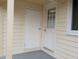 Outdoor space showing access to backyard with entry doors and view of the window at 912 Dixie Trl, Raleigh, NC 27607