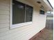 Home exterior featuring yellow siding and updated windows at 912 Dixie Trl, Raleigh, NC 27607