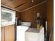 Laundry room with a side-by-side washer and dryer and utility sink with window at 912 Dixie Trl, Raleigh, NC 27607