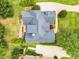Aerial view of a home with well-maintained landscaping, patio, and a private backyard at 921 Riverwood Dr, Clayton, NC 27527