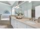 A spacious bathroom featuring a double vanity, soaking tub, elegant fixtures, and tasteful decor at 921 Riverwood Dr, Clayton, NC 27527
