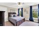 Comfortable bedroom with ceiling fan, ample natural light, and stylish décor at 921 Riverwood Dr, Clayton, NC 27527