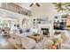 Living room showcases a balcony, fireplace, large windows, and open access to the dining room at 921 Riverwood Dr, Clayton, NC 27527