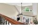 A bright, open-concept living area showcasing a vaulted ceiling, modern furnishings, and a picturesque backyard view at 921 Riverwood Dr, Clayton, NC 27527