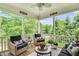 Cozy screened porch with comfortable seating, perfect for enjoying the outdoors in any weather at 921 Riverwood Dr, Clayton, NC 27527