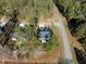 An aerial view of a cozy home nestled amongst mature trees offering privacy and natural beauty at 100 Carol Cir # 17, Louisburg, NC 27549