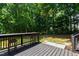 Inviting back deck with bar seating, perfect for outdoor entertaining and enjoying the serene backyard at 101 Eden Glen Dr, Holly Springs, NC 27540