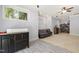 Comfortable basement area featuring a plush sofa, window, and convenient storage, perfect for relaxation and organization at 101 Eden Glen Dr, Holly Springs, NC 27540