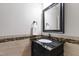 Elegant powder room with black granite countertop and decorative tile backsplash at 101 Eden Glen Dr, Holly Springs, NC 27540