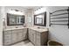 Well-lit bathroom with double sinks, large mirrors, and updated fixtures at 101 Eden Glen Dr, Holly Springs, NC 27540