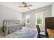 Bedroom with natural light, desk, and neutral decor at 101 Eden Glen Dr, Holly Springs, NC 27540