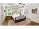 A bedroom featuring natural lighting, light colors, and a ceiling fan at 101 Eden Glen Dr, Holly Springs, NC 27540
