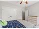 Well-lit bedroom featuring closet, dresser, and plush bedding at 101 Eden Glen Dr, Holly Springs, NC 27540