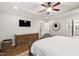 A spacious bedroom featuring hardwood floors and a wooden dresser at 101 Eden Glen Dr, Holly Springs, NC 27540