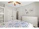 Bright bedroom with large dresser, closet, and a comfy quilt at 101 Eden Glen Dr, Holly Springs, NC 27540